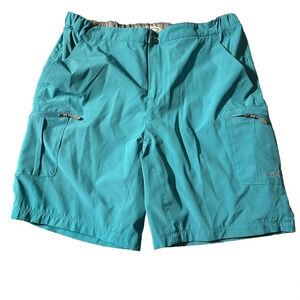 Reel Life men's mesh lined teal shorts size medium, with zip pocket on side